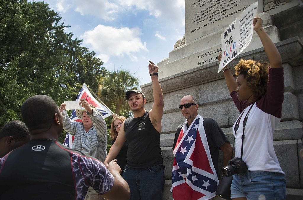 Pro-confederate flag demonstrator Peter Manos (center) argues with anti-confederate flag protester Jalaudin Abdul-Hamib (left) outside the South Carolina State House in Columbia, South Carolina, June 27, 2015. Photo Jim Watson/AFP/Getty Images.
