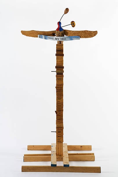  Jimmie Durham, Choose Any Three, 1989 Carved ash, magnolia, pine, metal, glass, acrylic paint. 99 ¼ × 49 ¼ × 48 in. (252 × 125 × 122 cm). Hammer Museum, Los Angeles. Purchased with partial funds provided by Susan Bay Nimoy and Leonard Nimoy. Image courtesy of kurimanzutto, Mexico City.