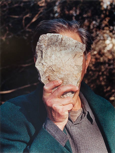 Jimmie Durham, Self-Portrait Pretending to Be a Stone Statue of Myself, 2006 Color photograph. Edition of 1 + 1 AP. 31 ¾ × 24 in. (80.7 × 60.9 cm). Collection of fluid archives, Karlsruhe. Courtesy of ZKM Center for Art and Media, Karlsruhe.