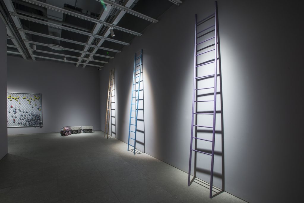 Installation view of Bunny Rogers: Brig Und Ladder (Whitney Museum of American Art, New York, July 7–October 9, 2017). From left to right: Memorial wall (fall) (2017); Lady train set (2017);Ladder 12 (2017); Ladder 14 (2017); Ladder 13 (2017). Photograph by Bill Orcutt.