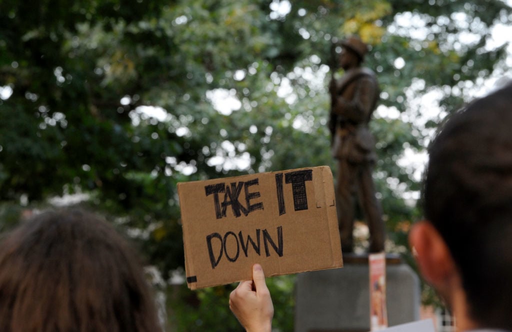 Demonstrators rally for the removal of a Confederate statue coined Silent Sam on the campus of the University of Chapel Hill on August 22, 2017 in Chapel Hill North Carolina. Photo by Sara D. Davis/Getty Images.