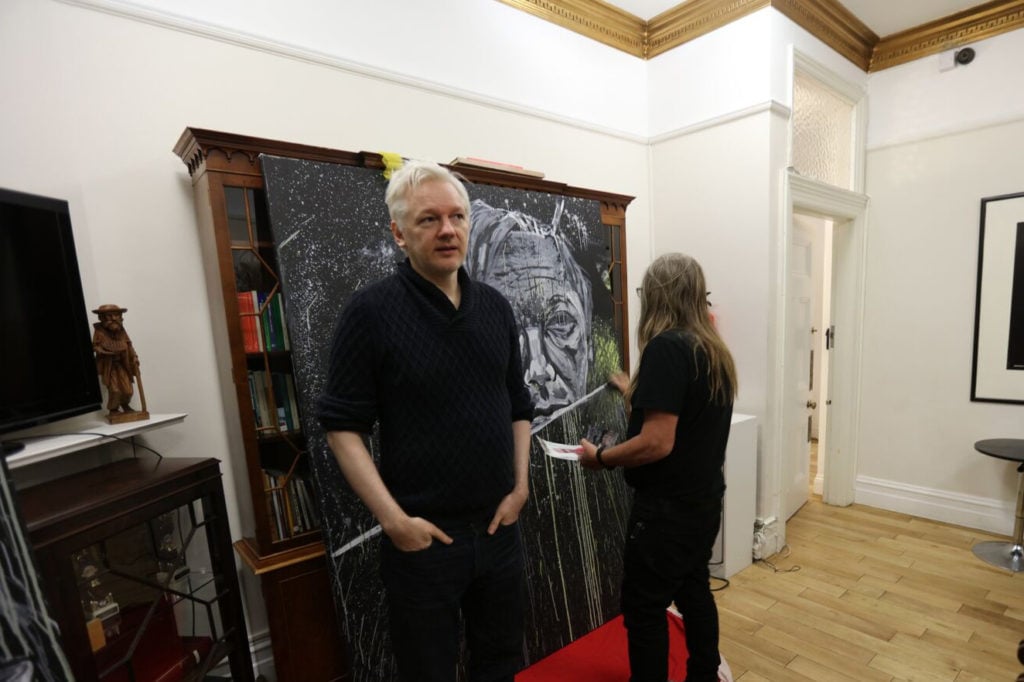 Artist George Gittoes with Julian Assange at the Ecuadorian Embassy in London. Courtesy of the artist.
