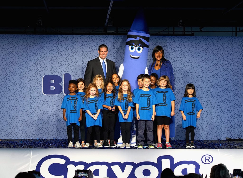 Crayola CEO and president Smith Holland and senior vice president of marketing Melanie Boulden enlisted a group of children to announce Bluetiful, the winning name of its new blue crayon based on the newly-discovered YInMn Blue. Courtesy of Bennett Raglin/Getty Images for Crayola.
