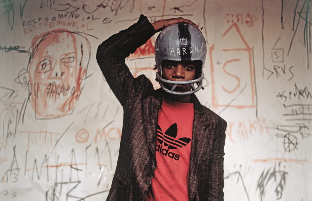 Jean-Michel Basquiat. © Edo Bertoglio, courtesy of Maripol. Artwork: © The Estate of Jean-Michel Basquiat. Licensed by Artestar, New York.