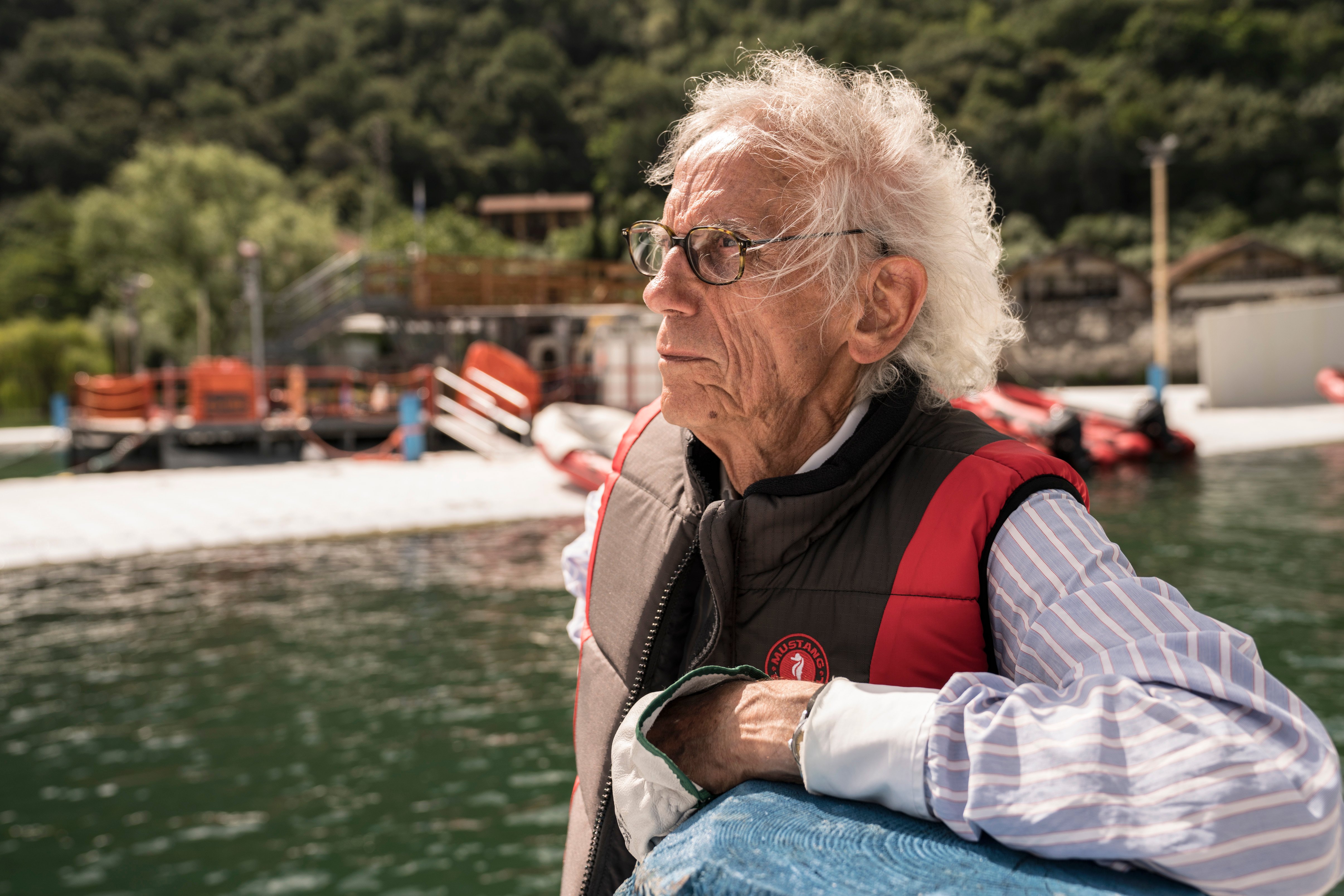 Christo working in June 2017, at Lake Iseo, Italy, on Christo and Jeanne-Claude: The Floating Piers, Lake Iseo, Italy 2014-16. Photo: Wolfgang Volz.