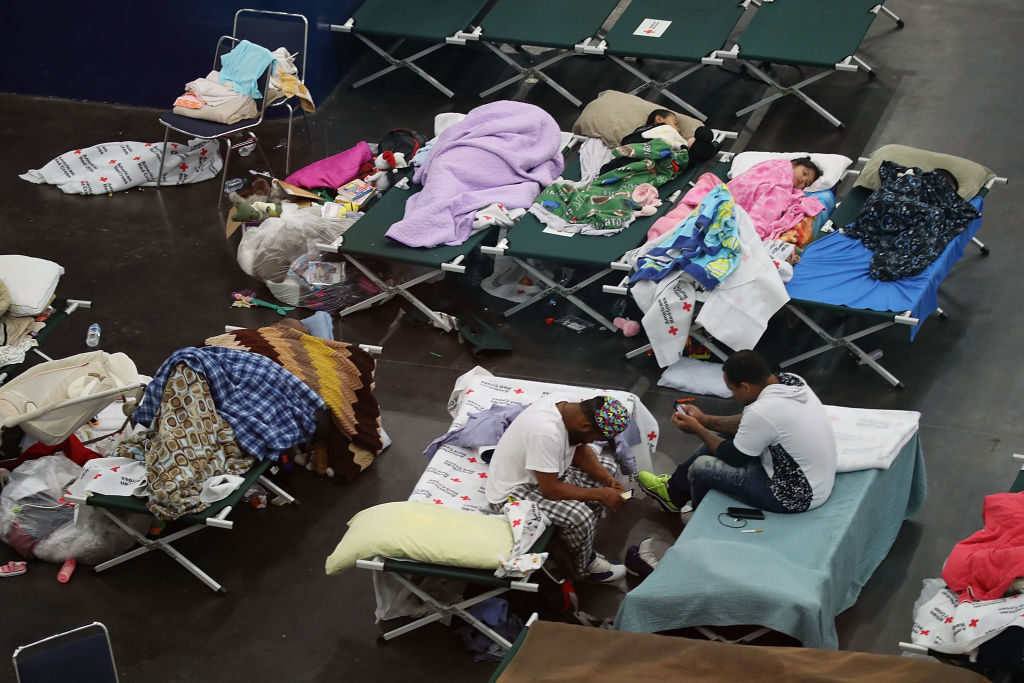 People take shelter at the George R. Brown Convention Center after flood waters from Hurricane Harvey inundated the city on August 29, 2017 in Houston, Texas. Photo by Joe Raedle/Getty Images.