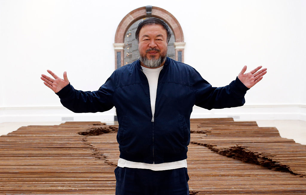 Ai Weiwei alongside his work Straight (2015). Photo by Alex B. Huckle/Getty Images.