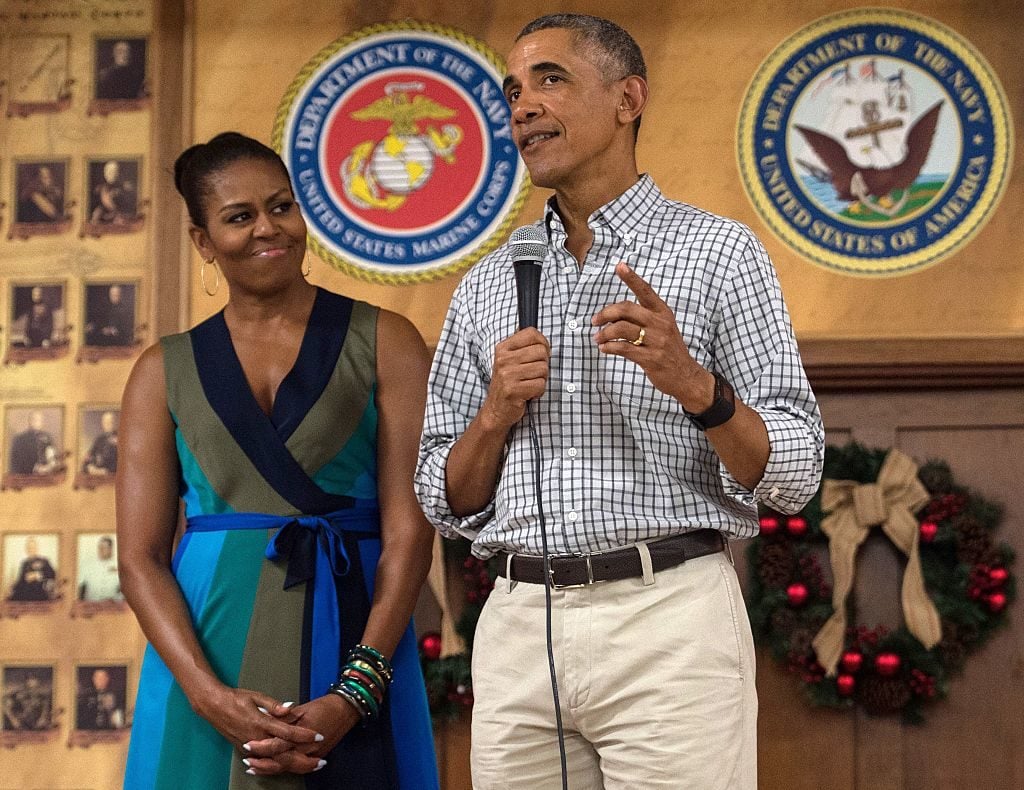 US President Barack Obama addresses troops with First Lady Michelle Obama at Marine Corps Base Hawaii in Kailua on December 25, 2016. Photo Nicholas Kamm/AFP/Getty Images.