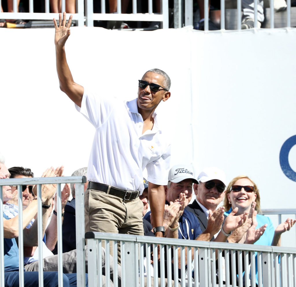 Former U.S. President Barack Obama is introduced during Thursday foursome matches of the Presidents Cup at Liberty National Golf Club on September 28, 2017 in Jersey City, New Jersey. (Photo by Elsa/Getty Images)