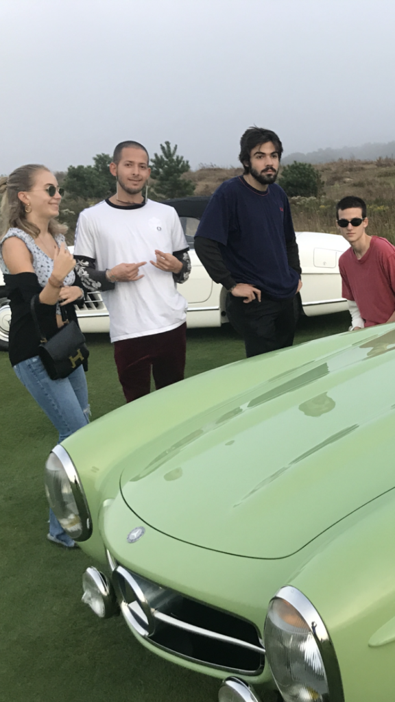 Caroline Hoffman, Adrian Schachter, Caio Twombly, and Kai Schachter with a Mercedes 300SL at the Bridge fair. Image courtesy of Kenny Schachter.