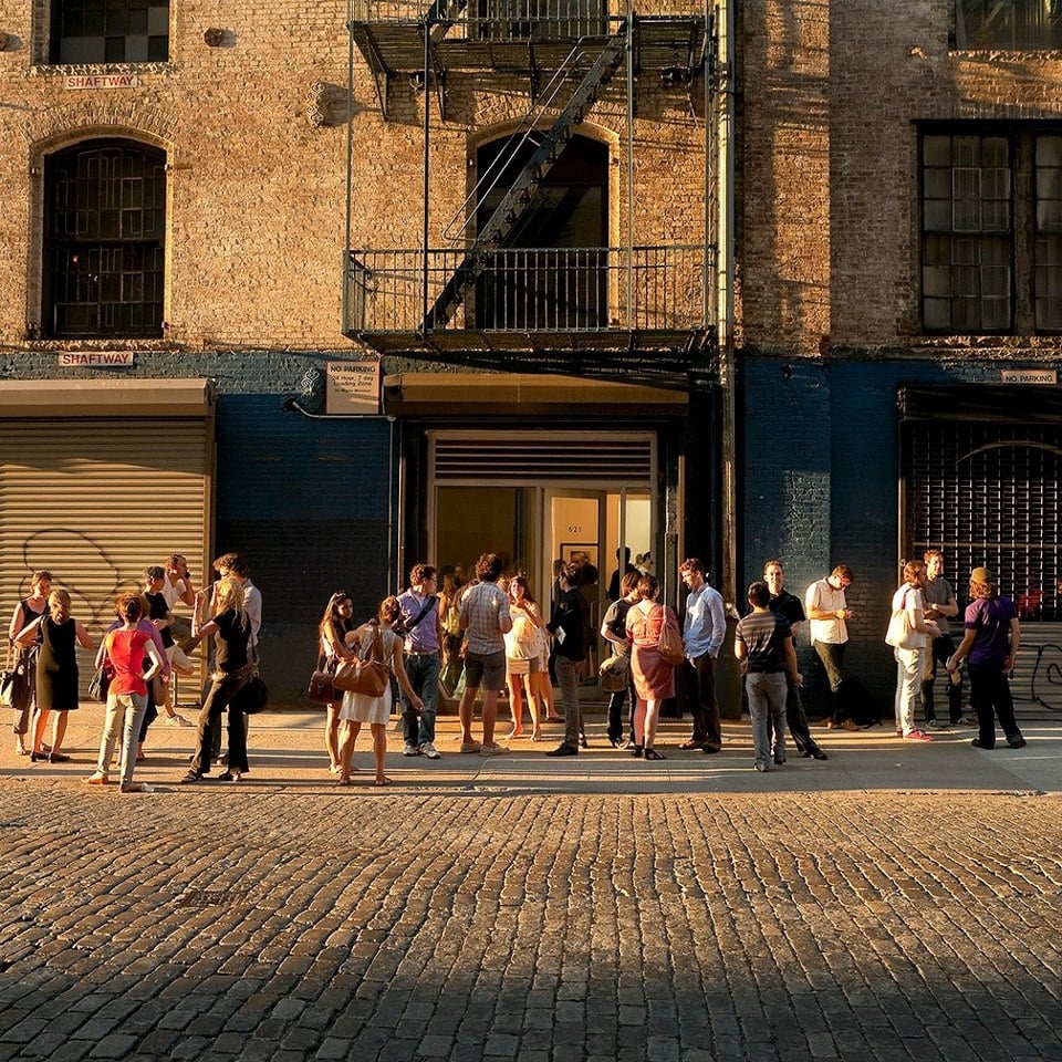 Visitors outside a gallery on 27th Street in New York's Chelsea gallery district. Photograph by Etienne Frossard.