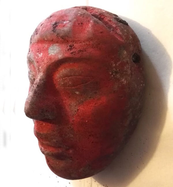 The jade mask found in Burial 80 at the El Perú-Waka’ Regional Archaeological Project in Guatemala. Courtesy of Proyecto Arqueológico Waka’ and the Ministry of Culture and Sports of Guatemala.