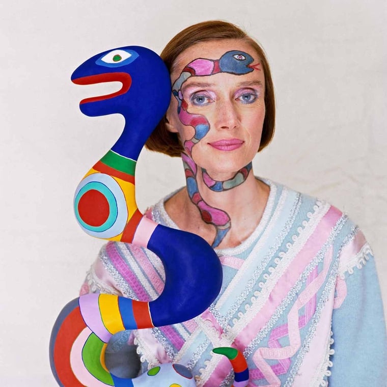 The French sculptor, painter and film-maker, Niki de Saint Phalle (1930 - 2002), photographed with one of her sculptures. Photo: Courtesy of the Norman Parkinson gallery.