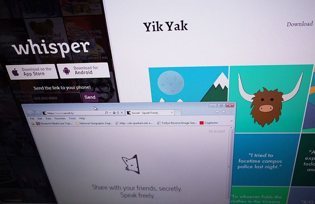 Websites for anonymous social networking apps Whisper and Yik Yak. Photo by Mandel Ngan/AFP/Getty Images.
