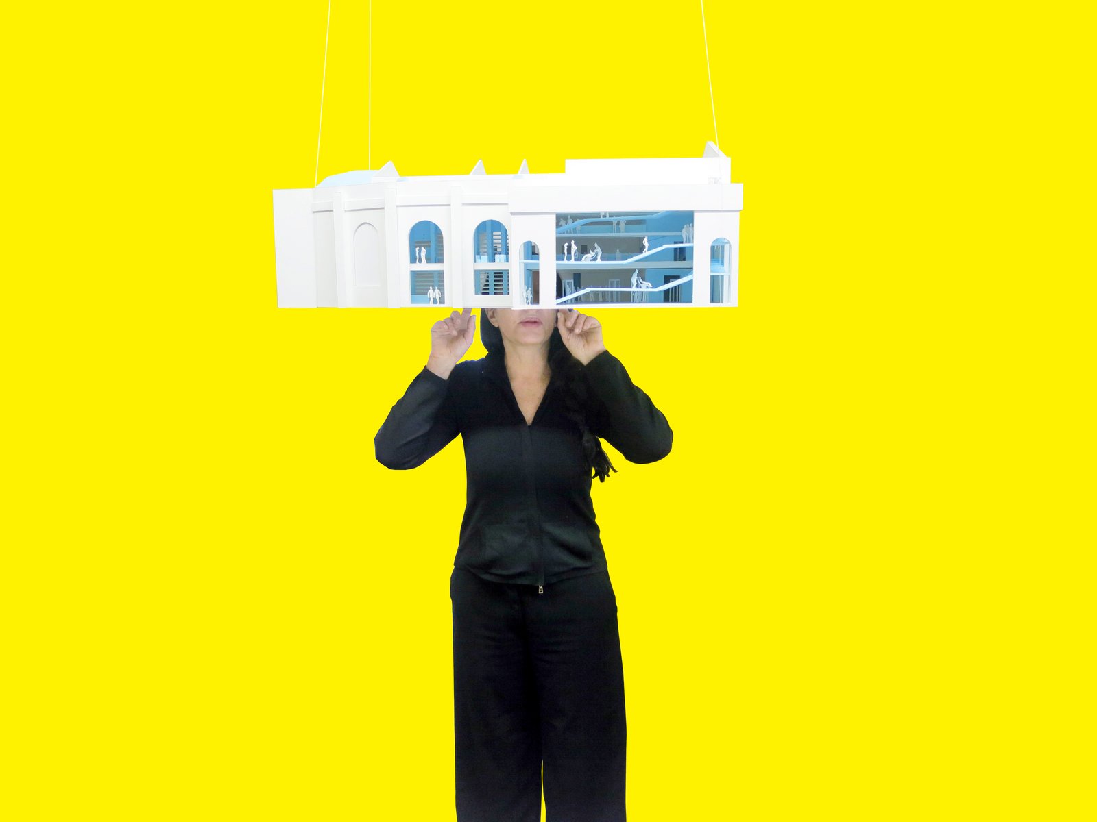 Marina Abramović with Rem Koolhaas's model for the Marina Abramović Institute. © OMA.