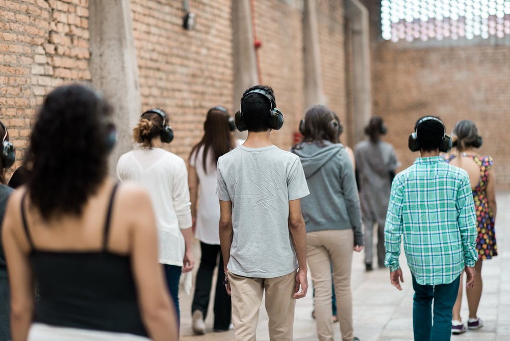 Visitors to the Marina Abramović Institute wear noise-cancelling headphones. Courtesy of the Marina Abramović Institute.