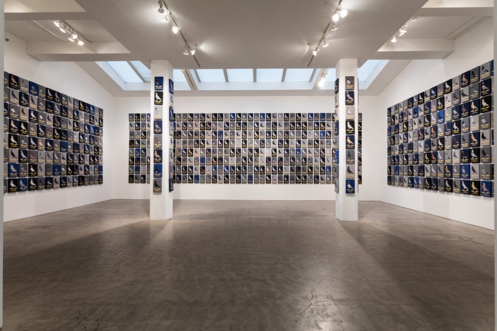 Duke Riley's "Now Those Days Are Gone," installation shot at Magnan Metz gallery, showing the 1,000 individual, hand-painted and embroidered portraits of pigeons from the Fly by Night fleet. Courtesy of Magnan Metz.