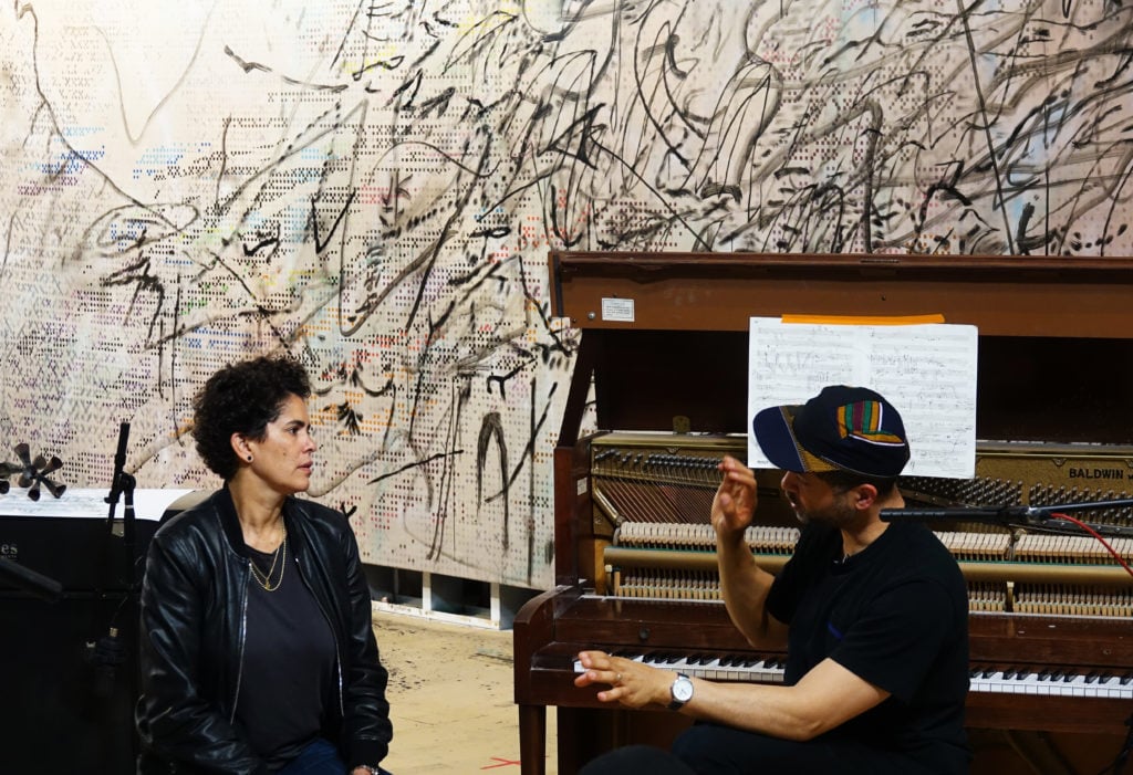 Julie Mehretu and Jason Moran collaborate on their project, (2017). Courtesy of Damien Young.