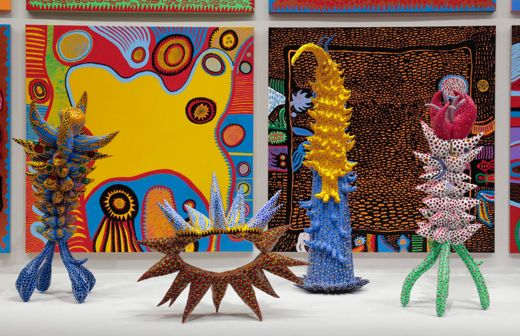 Installation view of "Yayoi Kusama: Infinity Mirrors" at the Hirshhorn Museum and Sculpture Garden, 2017. Left to right: Living on the Yellow Land (2015), My Adolescence in Bloom (2014), Welcoming the Joyful Season (2014), Surrounded by Heartbeats 2014), Unfolding Buds (2015), Story After Death (2014). Photo by Cathy Carver.