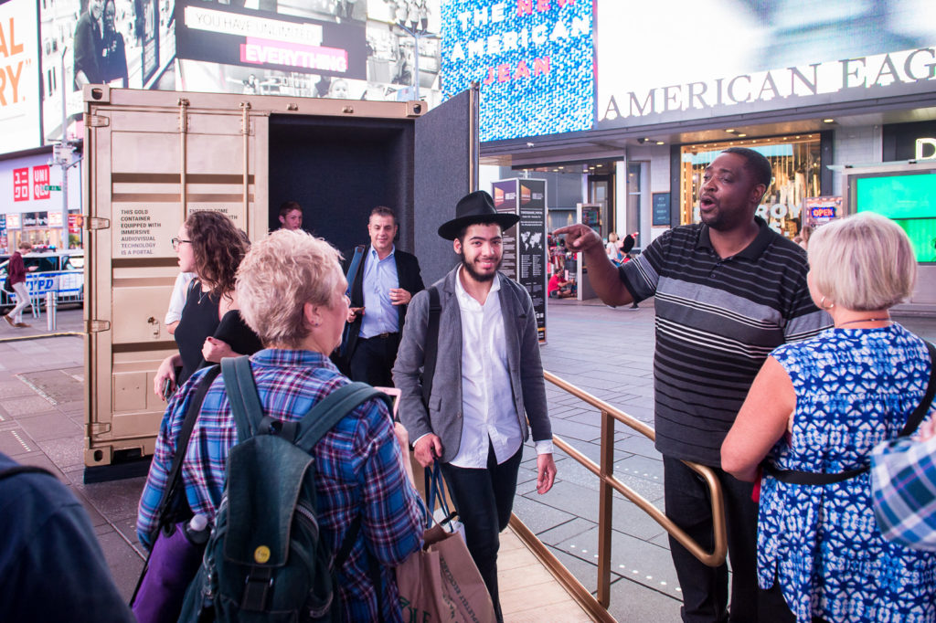 Visitors at the "Times Square Portal", image courtesy of Ian Douglas for Times Square Arts.