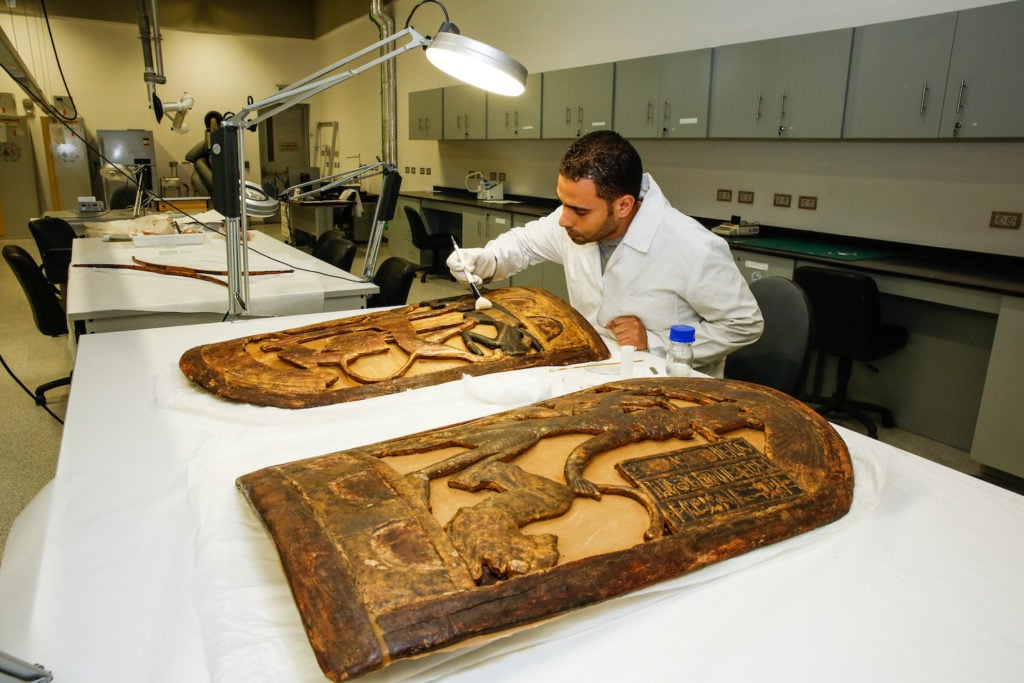 The restorer Ahued El Sheikka carries out a complete                restoration of two shields from the tomb of Tutankhamen.                Photo courtesy of Philippe Bourseiller/Getty Images                Reportage.