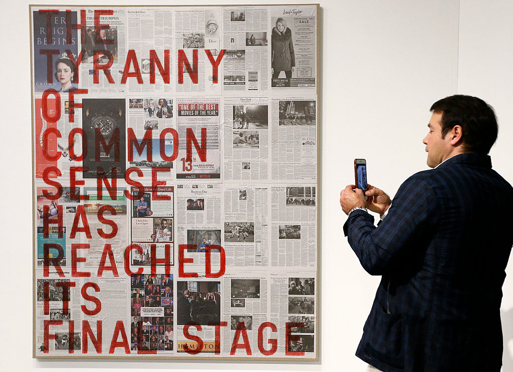 A visitor snaps a picture of "Untitled 2016" by Rirkrit Tiravanija during Art Basel Rhona Wise/AFP/Getty Images.