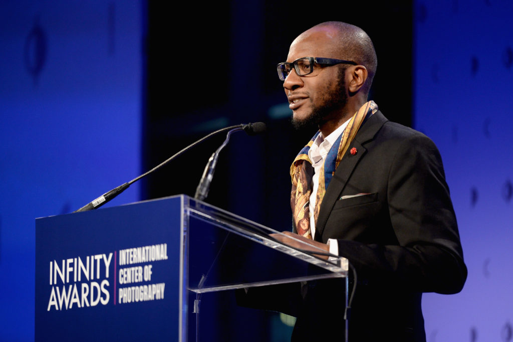 Photographer Teju Cole presents an award at The International Center of Photography's 33rd Annual Infinity Awards Photo: Andrew Toth via Getty Images.