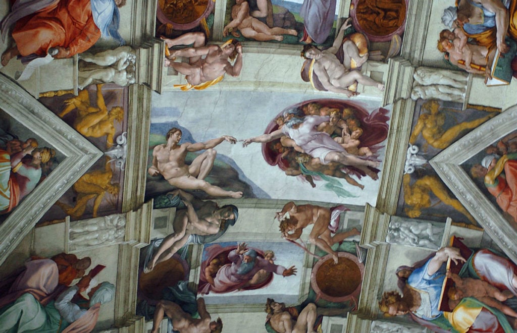 Part of the artwork of Michelangelo that adorns the ceiling of the Sistine Chapel at the Vatican, Italy. Photo by Fotopress/Getty Images.