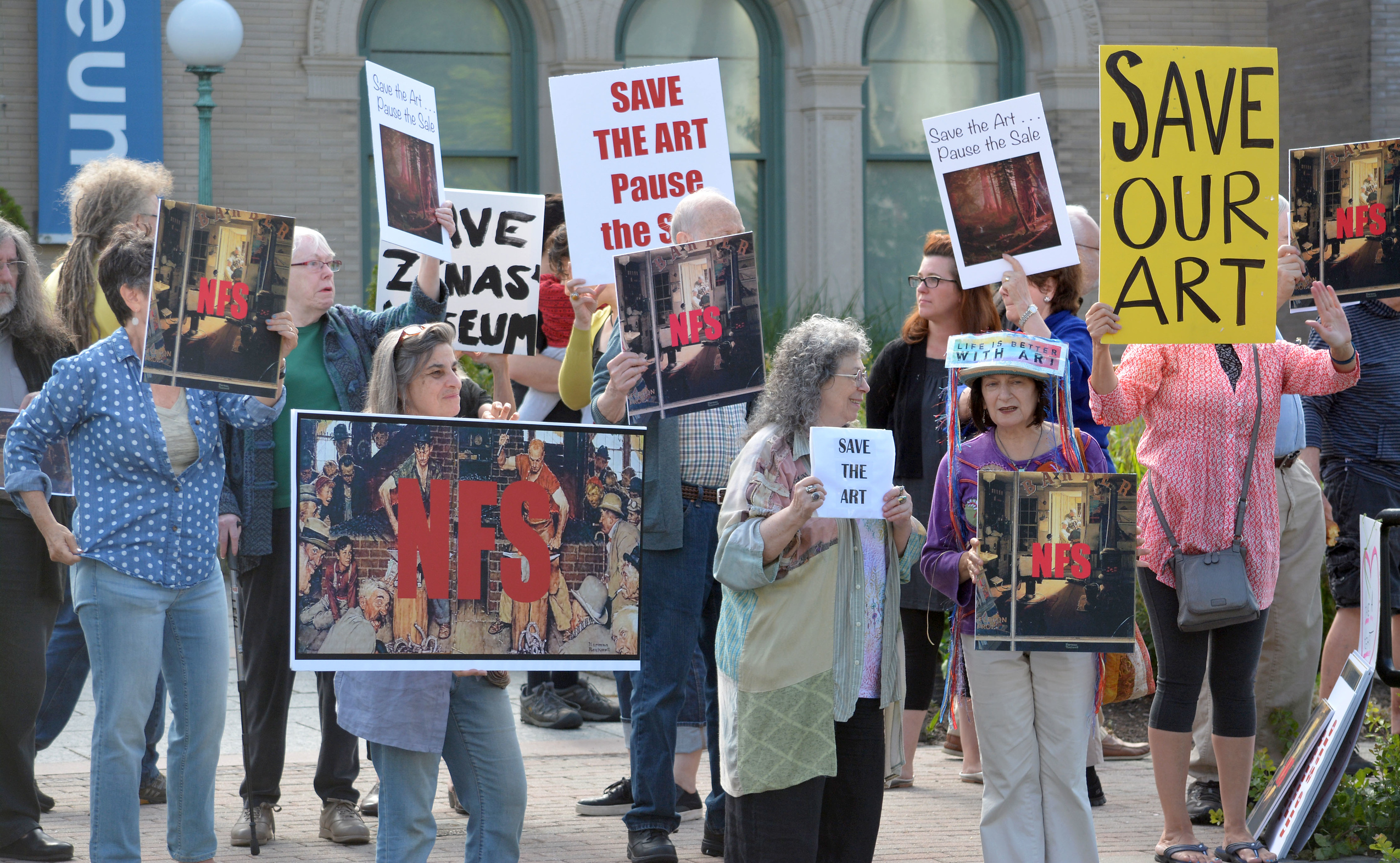 THE BERKSHIRE EAGLE About 40 people protested the selling of artwork by the Berkshire Museum to fund their expansion and create an endowment, in front of the museum on Saturday, August 12, 2017. © Gillian Jones/ Berkshire Eagle.