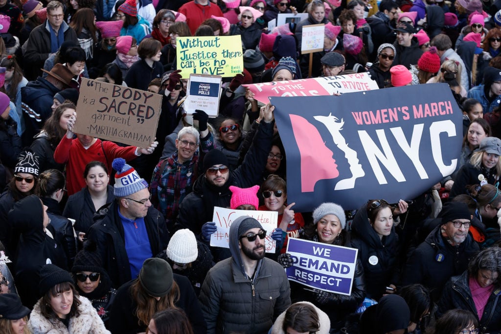 Demonstrators are seen during the 2018 Women's March in New York City on January 20, 2018 in New York City. Photo courtesy of John Lamparski/Getty Images.