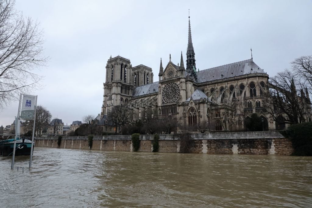 The flooded banks of the Seine river, next to Notre Dame cathedral, in Paris, January 23, 2018. Photo: Ludovic Marin/AFP/Getty Images.