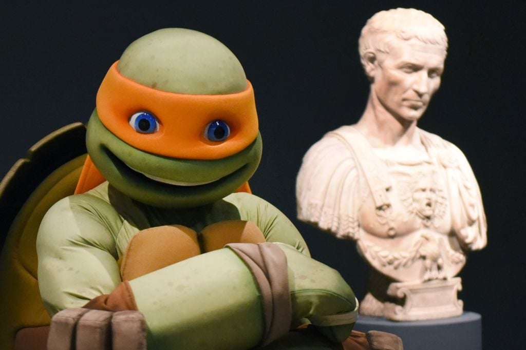 The Teenage Mutant Ninja Turtle Michelangelo, aka Mikey, visits the exhibition "Michelangelo: Divine Draftsman and Designer". Timothy A. Clary/AFP/Getty Images.