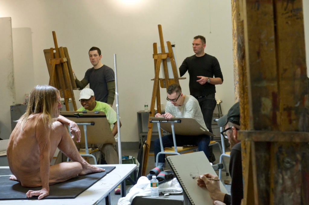 Michael Grimaldi (standing, right) draws Iggy Pop in the Life Class by Jeremy Deller st the Brooklyn Museum, February 21, 2016. Photo courtesy of Elena Olivo and the Brooklyn Museum.