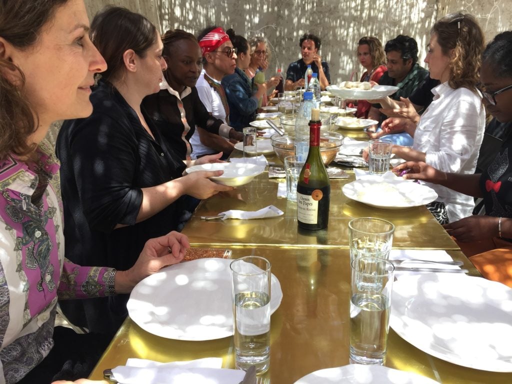 Lunch in Dakar, including Ingrid Schaffner, Carin Kuoni, Koyo Kouoh, Sumesh Sharma, Satch Hoyt, Mara Ambrožič, Chiara Bertola, Marita Muukkonen, Carole Diop, and others. Courtesy of Ingrid Schaffner.