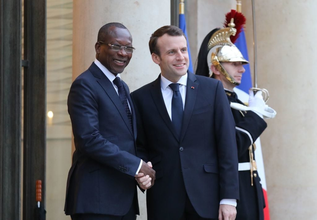 French President Emmanuel Macron shakes hands with Benin's president, Patrice Talon at the Elysee Palace in Paris. Photo by Ludovic Marin/AFP/Getty Images.