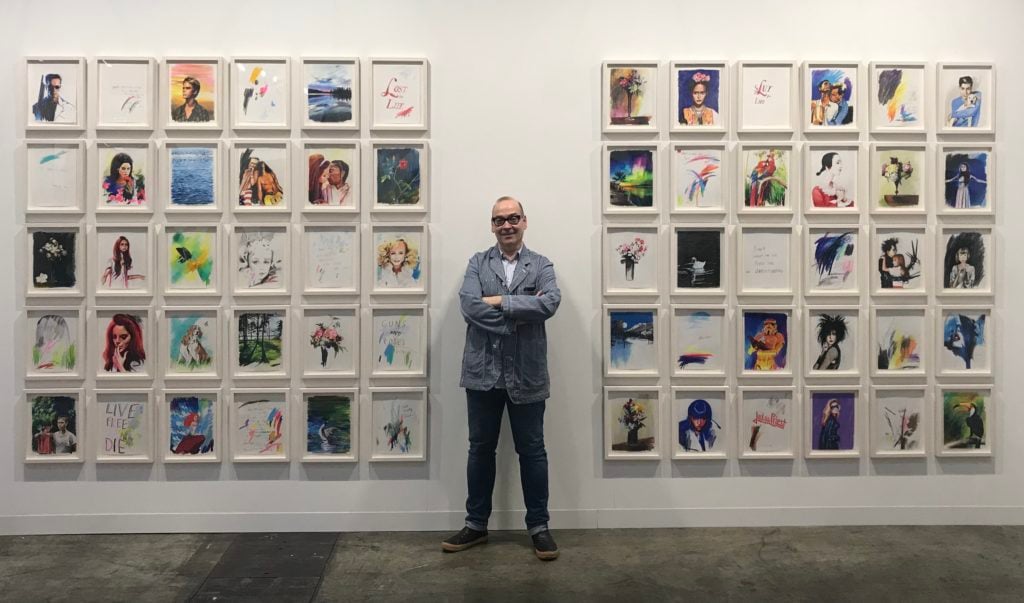 The dealer Jose Freire with Sam McKinniss's drawings at Art Basel Hong Kong in 2018, the gallery's final art fair. Photo by Andrew Goldstein.
