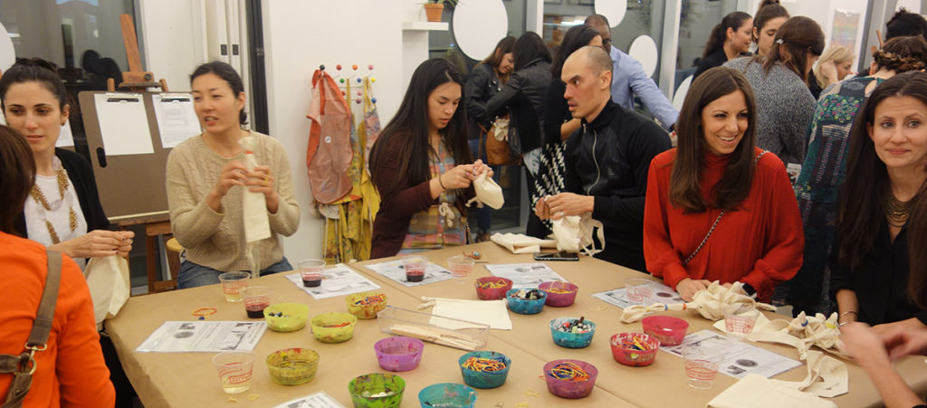 Adults making crafts at the Children's Museum of the Arts. Photo courtesy of the Children's Museum of the Arts.