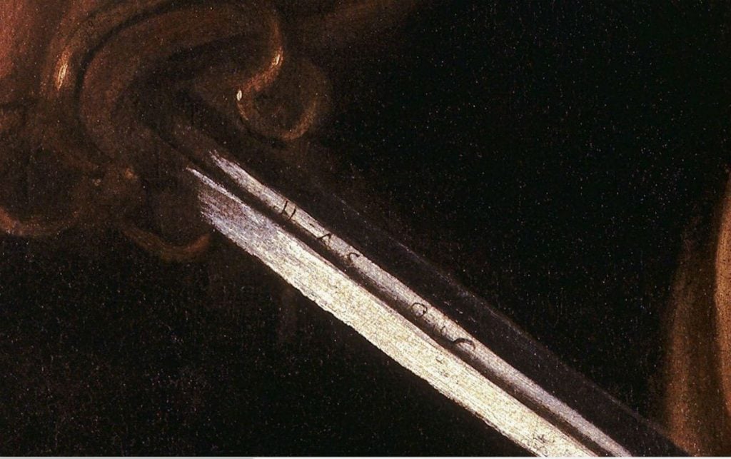 Caravaggio, <i>David with The Head of Goliath,</i> (1610), detail of the sword. Courtesy of the Ministry of Cultural Heritage and Activities and Tourism, collection of the Galleria Borghese, Rome.