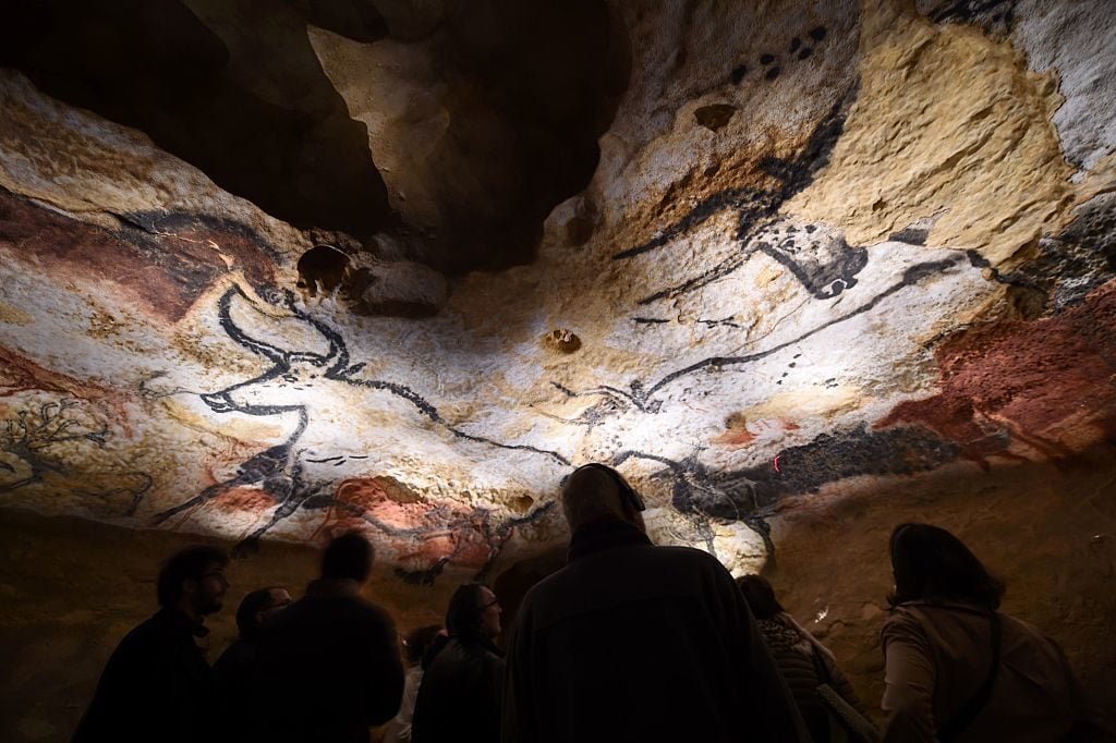 People visit the new replica of the Lascaux cave paintings, during the first public opening on December 15, 2016 in Montignac. The Lascaux cave painitngs were a subject of fascination for Georges Bataille. Photo courtesy Mehdi Fedouach/AFP/Getty Images.