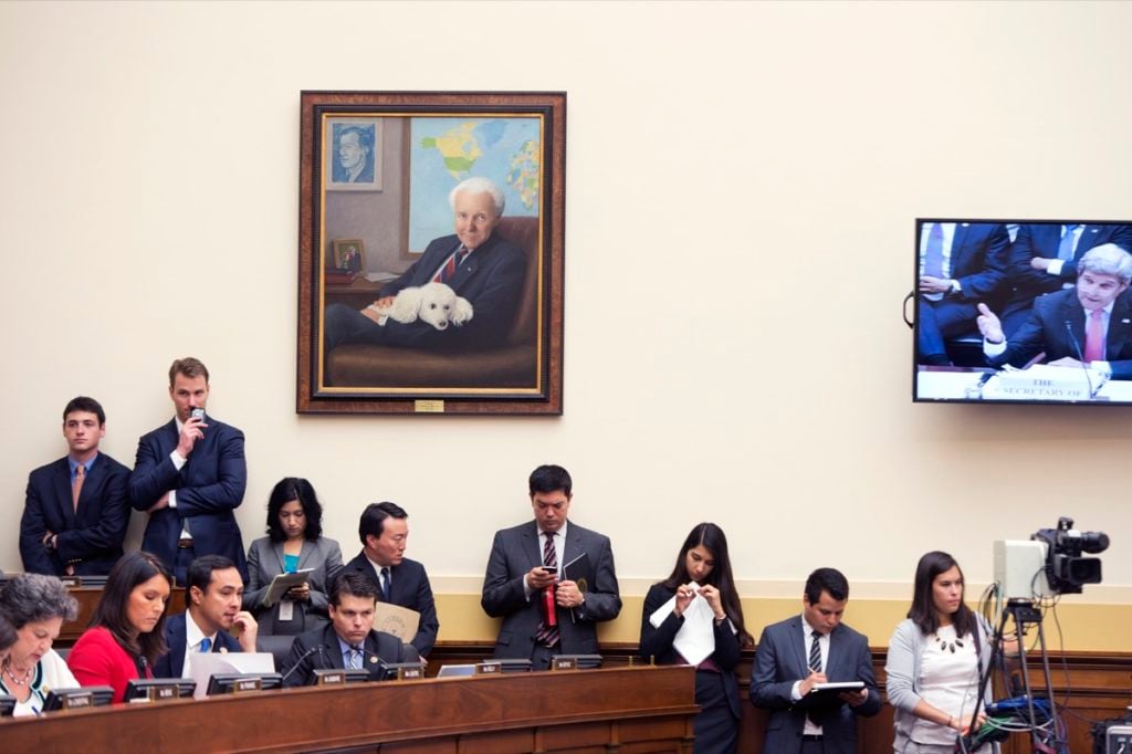 Laurel Stern Boeck's Thomas Peter Lantos (2011), depicting former Foreign Affairs Committee chairman Tom Lantos with his beloved poodle Gigi, can be seen on the wall at a House Foreign Affairs Committee hearing in the Rayburn Building. The painting is part of the collection of the US House of Representatives. Photo courtesy of Tom Williams/CQ Roll Call/Getty Images.