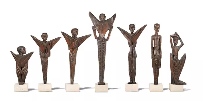 These seven wooden sculptures commissioned from Ben Enwonwu by the <em>Daily Mirror</em> in 1960 previously held the artist's auction record. Photo courtesy of Bonhams London.