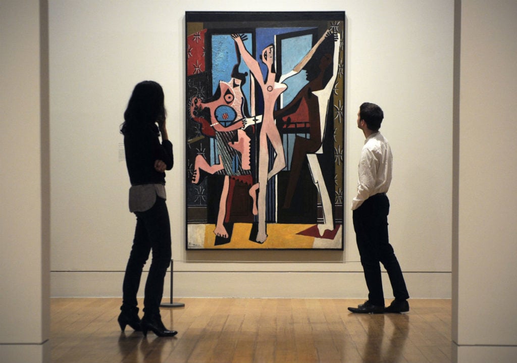 Pablo Picasso’s <em>The Three Dancers</em> (1925) at the Tate gallery, February 13, 2012. Photo courtesy Carl Court /AFP/Getty Images.