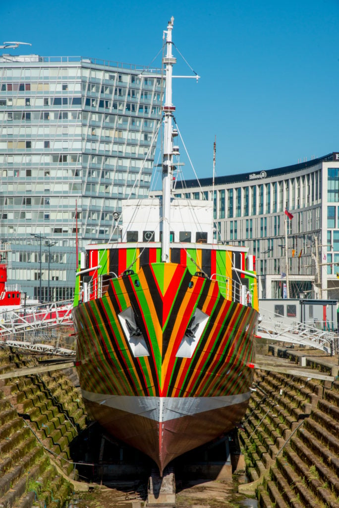 Carlos Cruz Diez, <em>Induction Chromatique à Double Fréquence pour l’Edmund Gardner Ship</eM> (2014). The artist created this dazzle ship for the Liverpool Biennial. Photo by Mark McNulty, courtesy 14-18 Now.