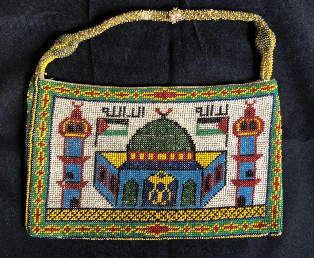 A beaded purse made around 1936 and used by Palestine Museum founder Faisal Saleh's mother for many years. The design shows the Dome of the Rock in Jerusalem. Photo courtesy of the Palestine Museum US.