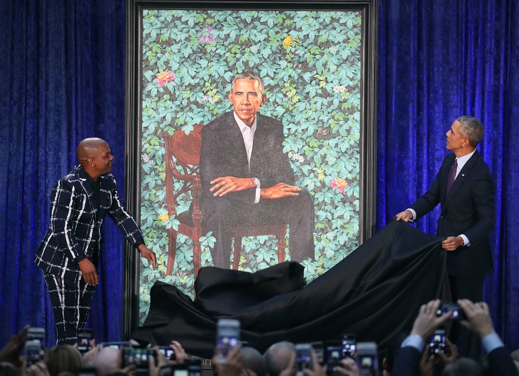 Former U.S. President Barack Obama (R) and artist Kehinde Wiley unveil his portrait during a ceremony at the Smithsonian's National Portrait Gallery, on February 12, 2018 in Washington, DC. Photo by Mark Wilson/Getty Images.