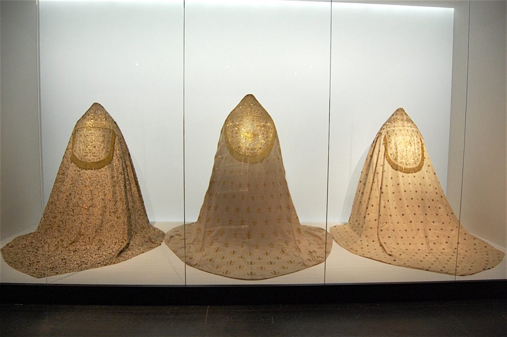 Installation view of "Heavenly Bodies" at the Met Fifth Avenue, Anna Wintour Costume Center. Photo by Sarah Cascone. 