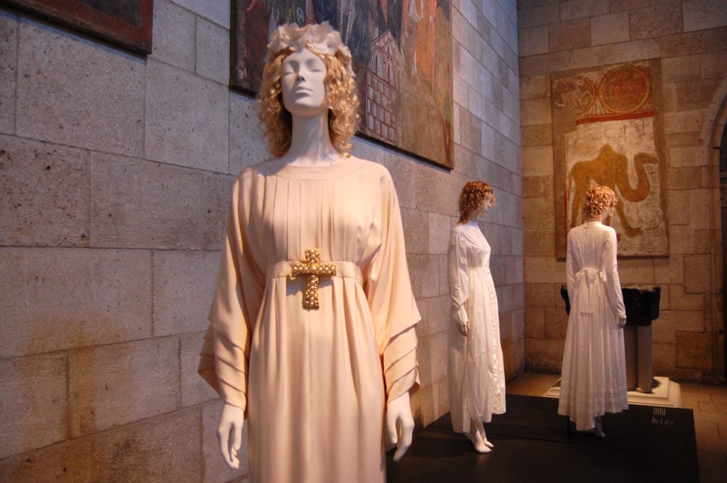 Karl Lagerfeld for House of Chanel, Wedding Ensemble, (1990–91), courtesy of Chanel, Paris, on view in "Heavenly Bodies" at the Met Cloisters. Photo by Sarah Cascone. 