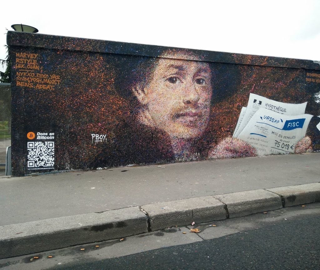 Pascal "PBOY" Boyart, Rembrandt dos au mur, a mural in Paris featuring a QR code that allows the public to donate to the artist using Bitcoin. Photo courtesy of the artist.