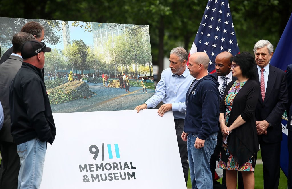 Actor/comedian Jon Stewart (right) attends the design unveiling of 9/11 memorial to honor 9/11 rescue workers on May 30, 2018 in New York City. Photo by Astrid Stawiarz/Getty Images.