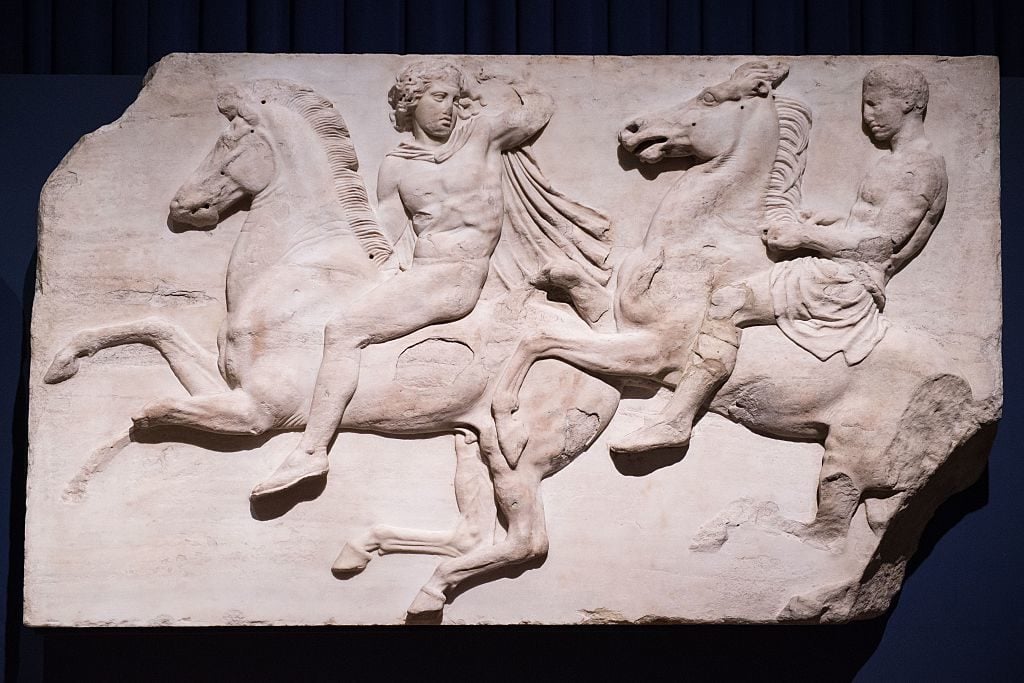A section of marble frieze sculpture (438-432 BC) from the Parthenon in Athens, part of the collection that is popularly referred to as the Elgin Marbles. Photo: Leon Neal/AFP/Getty Images.